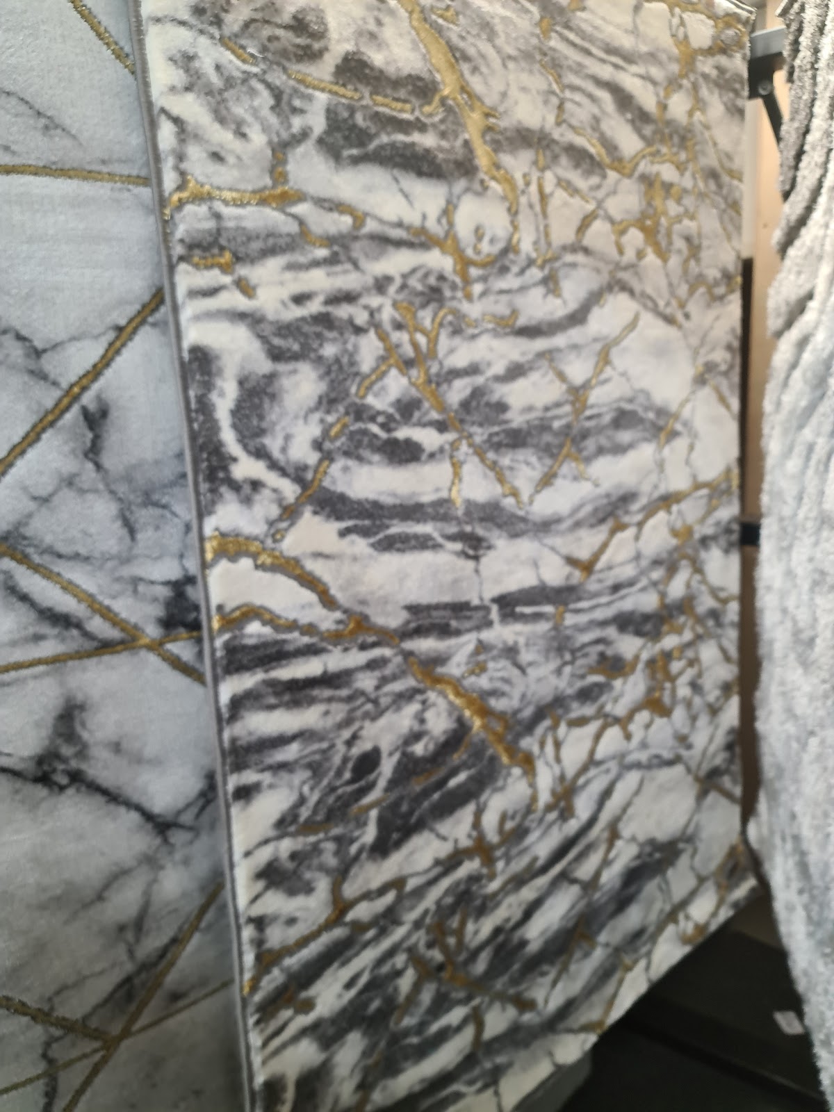 Marble and gold patterned rug