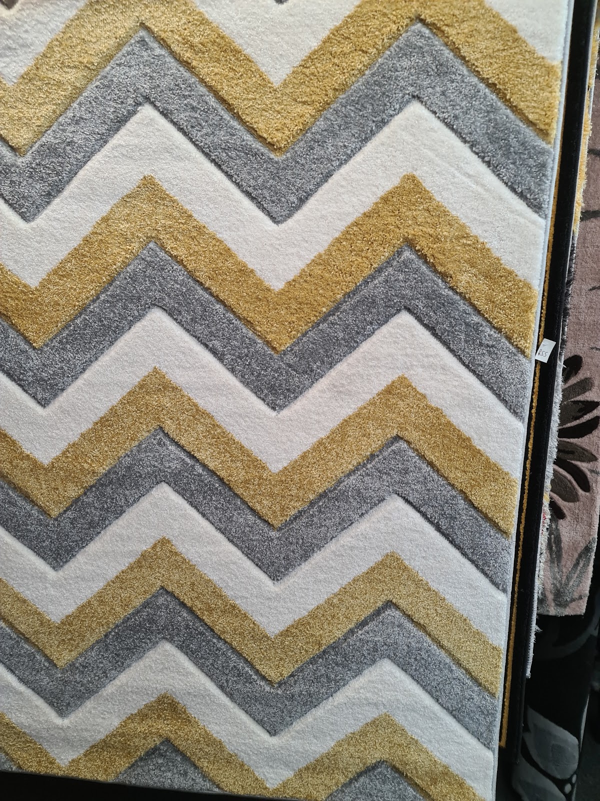Gold and grey chevron patterned rug