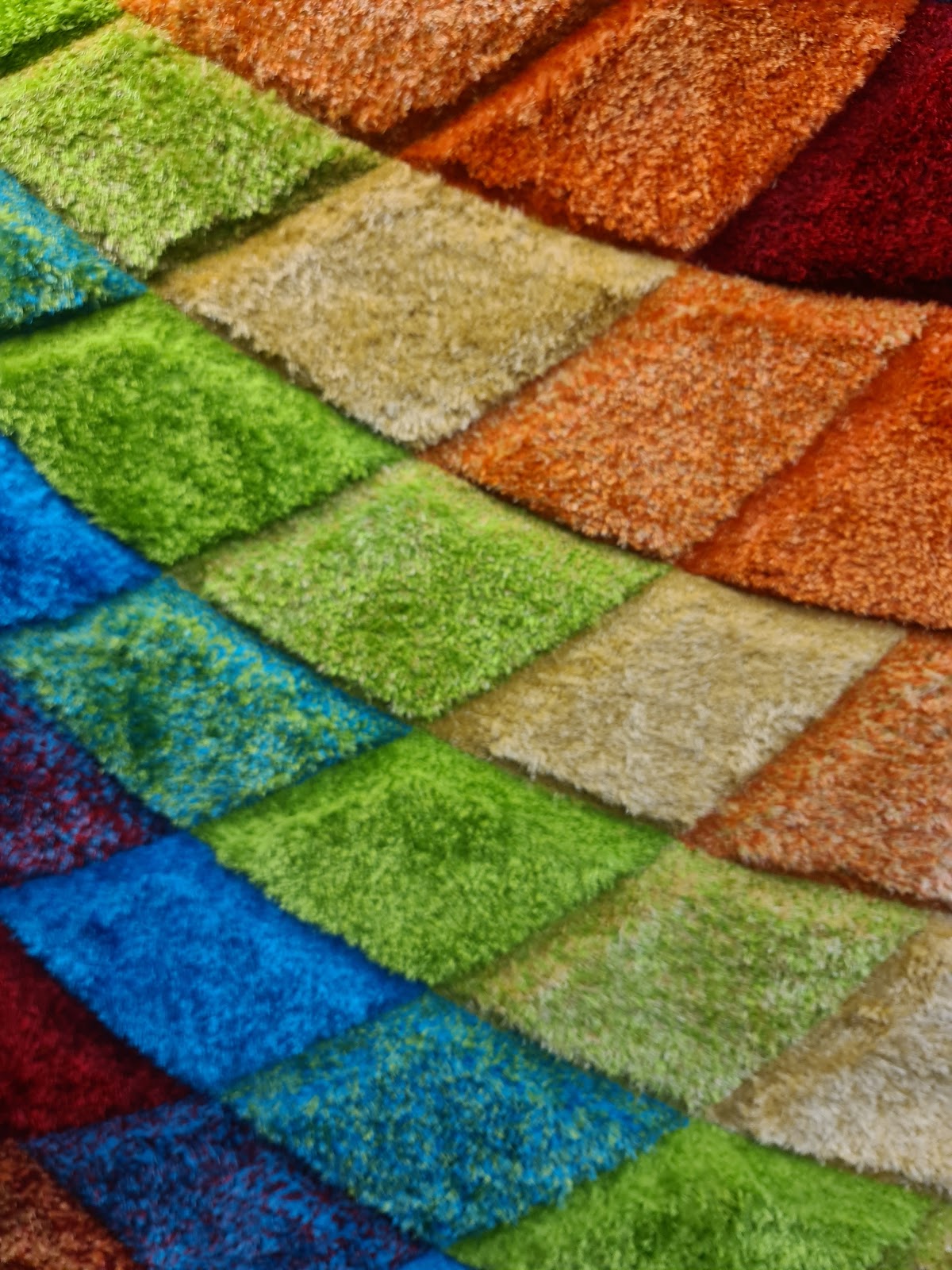 Colourful carpet samples on the showroom floor