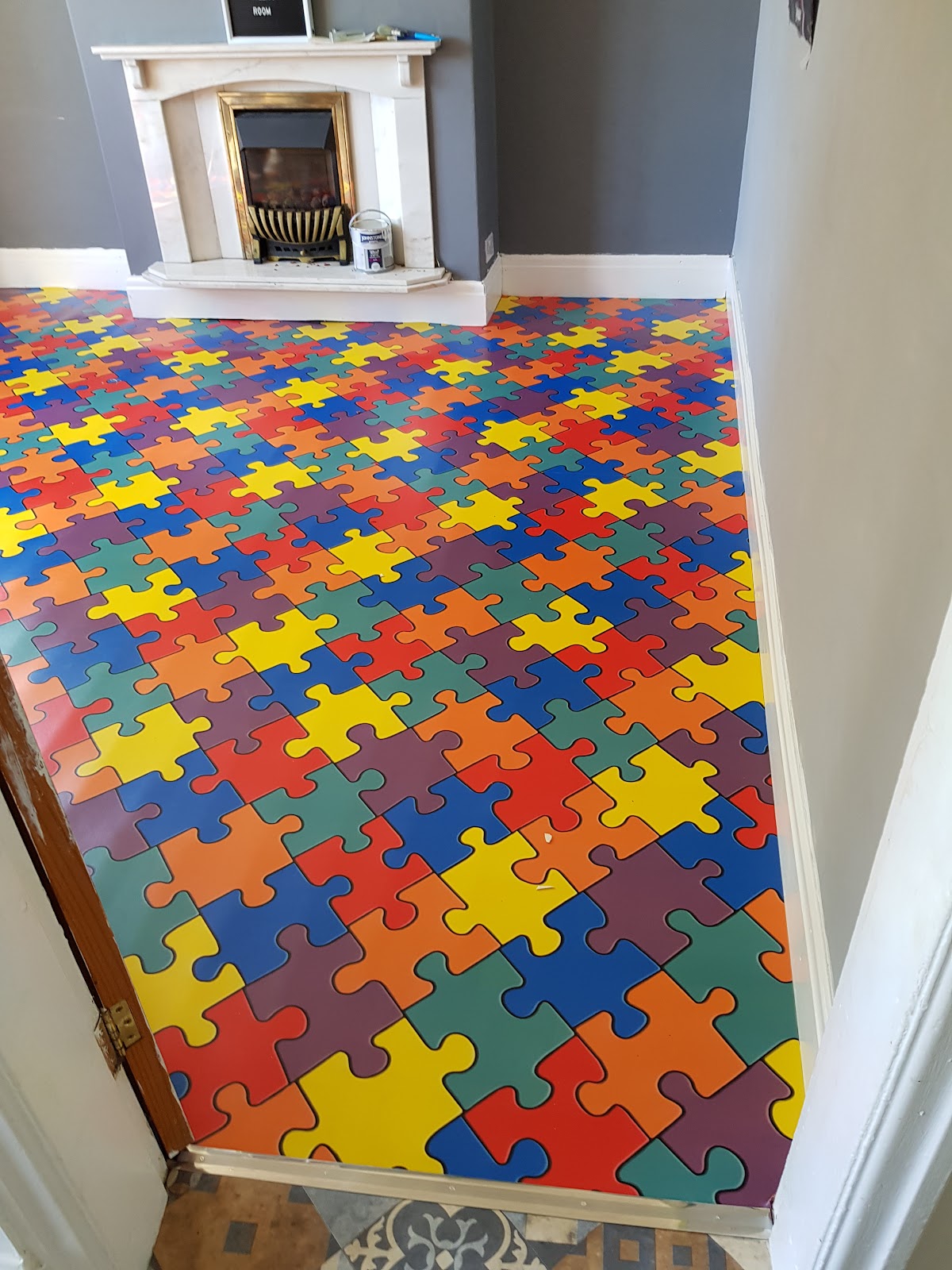 Colourful patterned vinyl floor fitted in a room