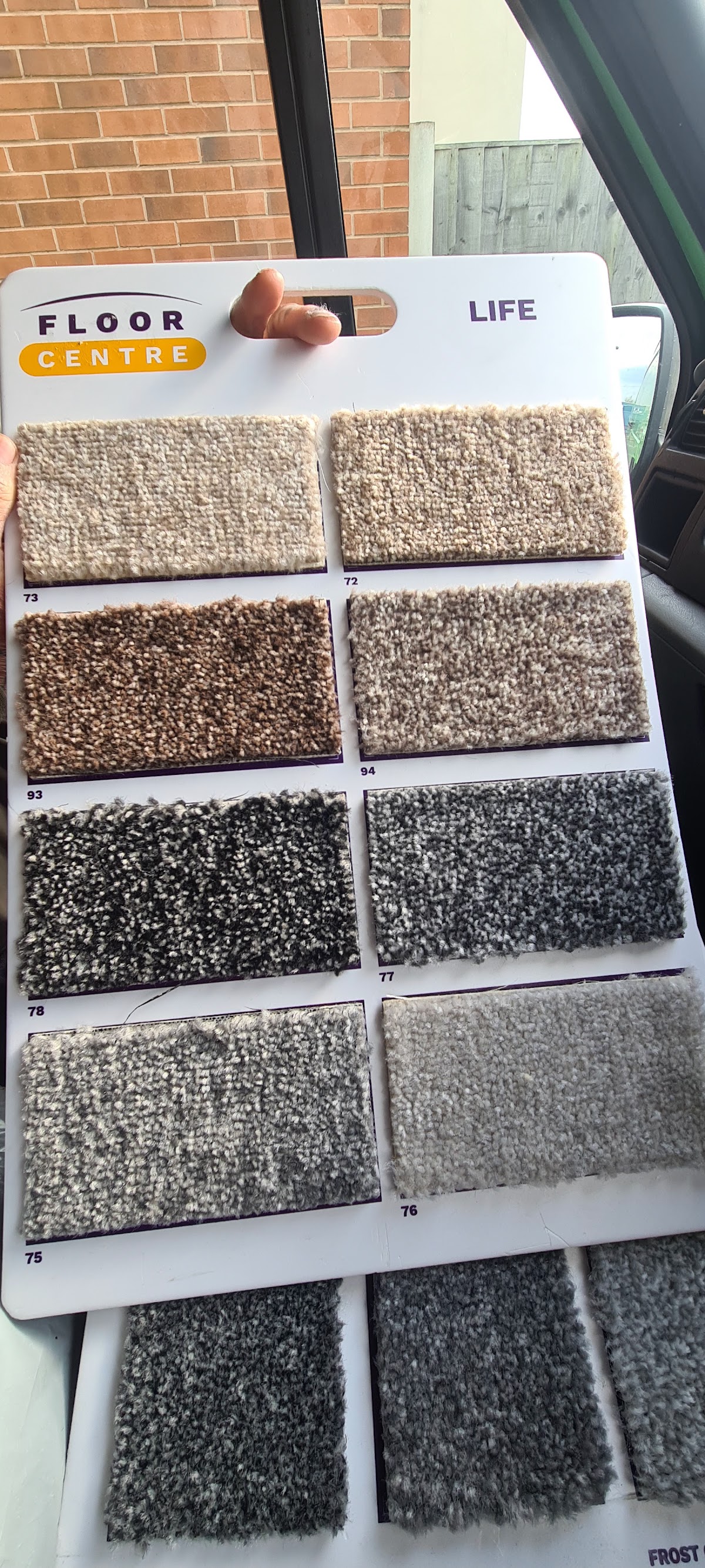 Carpet sample board of neutral and grey shades