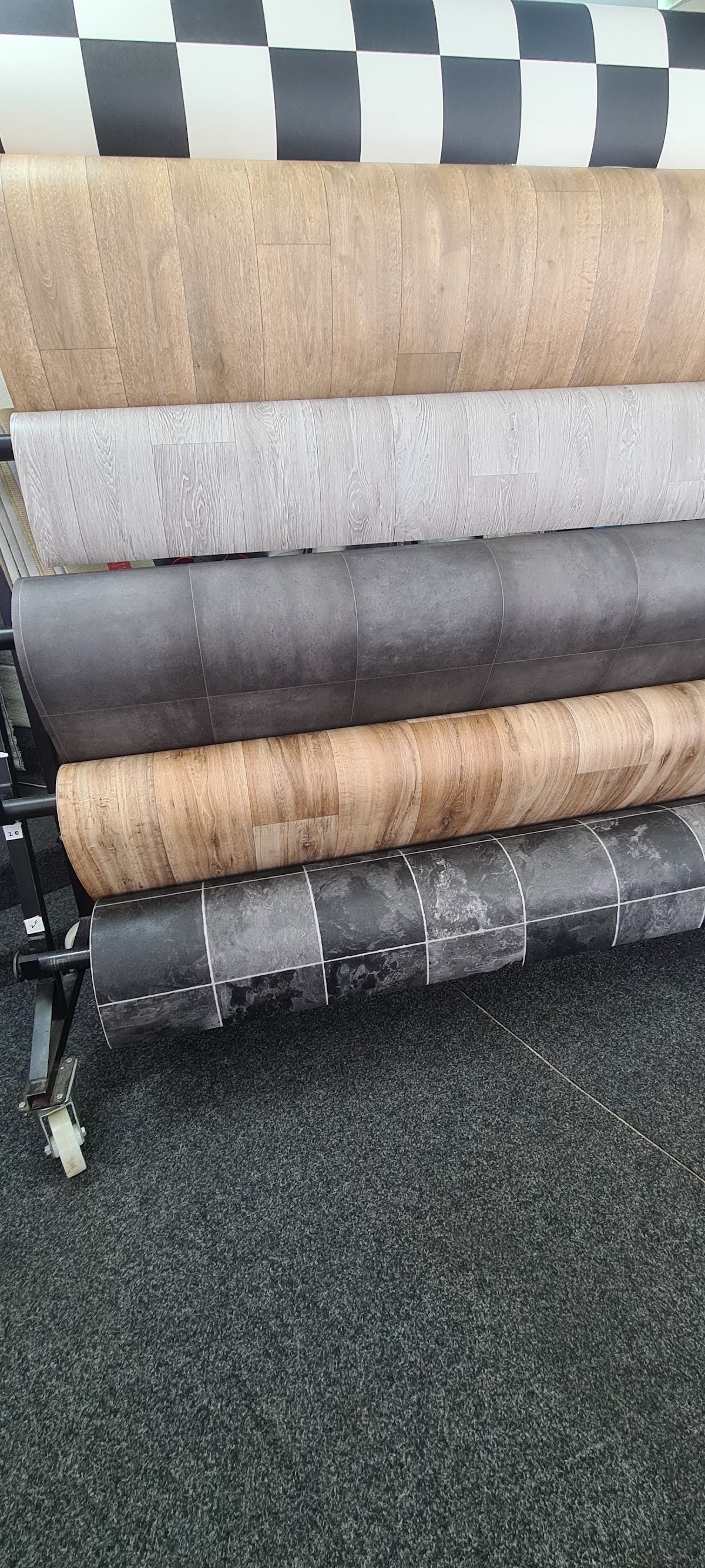 Rolls of vinyl and lino flooring on display